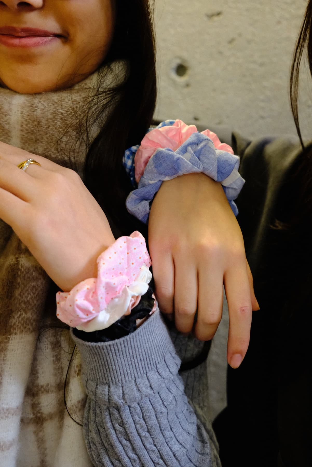 Friends showing off their rescued-fabric scrunchies